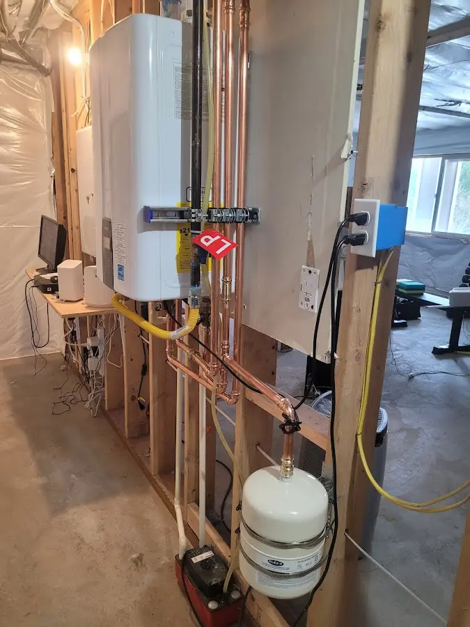 Licensed plumber repairing a kitchen sink in Chatham